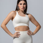 SEAMLESS RIBBED SUNSET BRA TOP — CREAM