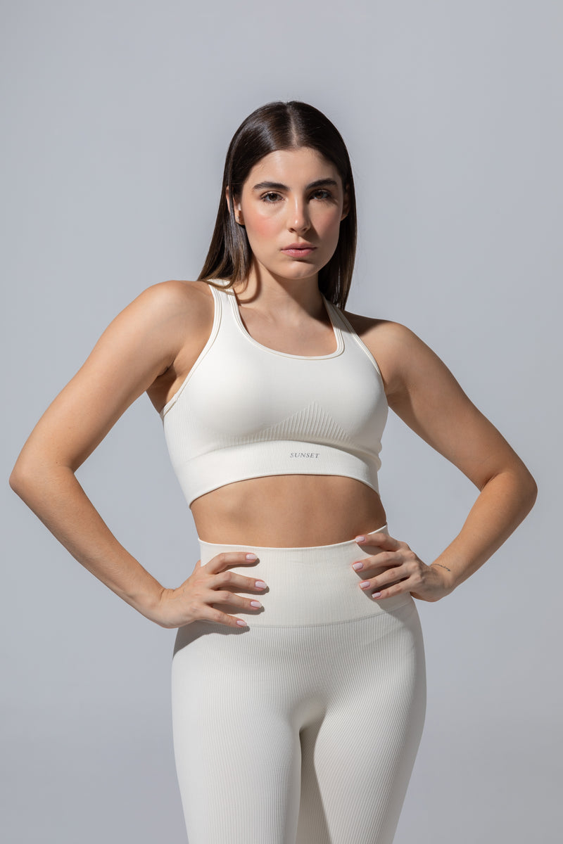 SEAMLESS RIBBED SUNSET BRA TOP — CREAM