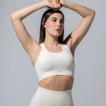 SEAMLESS RIBBED SUNSET BRA TOP — CREAM
